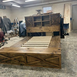 King size maxi storage bed with a bookshelf headboard