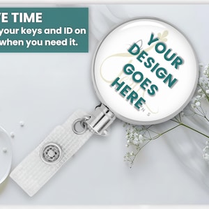 a badge holder with a magnifying glass on it, along with some white flowers and a small white object.