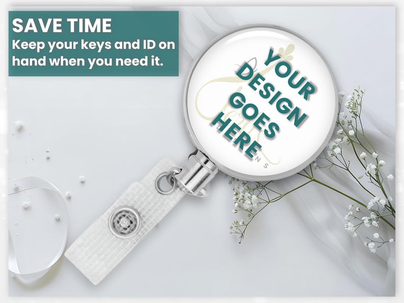 a badge holder with a magnifying glass on it, along with some white flowers and a small white object.