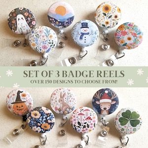 May include: A collection of badge reels with various designs, including a ghost, snowman, and floral patterns. The text "SET OF 3 BADGE REELS" and "OVER 150 DESIGNS TO CHOOSE FROM!" are displayed. These reels are attached to retractable cords.