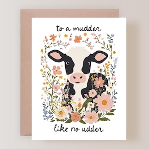 May include: Greeting card featuring a black and white cow surrounded by colorful flowers. The text "to a mudder like no udder" is written in black script. The card is on a white background with a pink envelope.