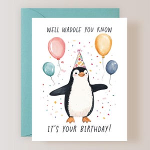May include: A birthday card featuring a penguin wearing a party hat and surrounded by confetti and balloons. The card reads "Well waddle you know, it's your birthday!"