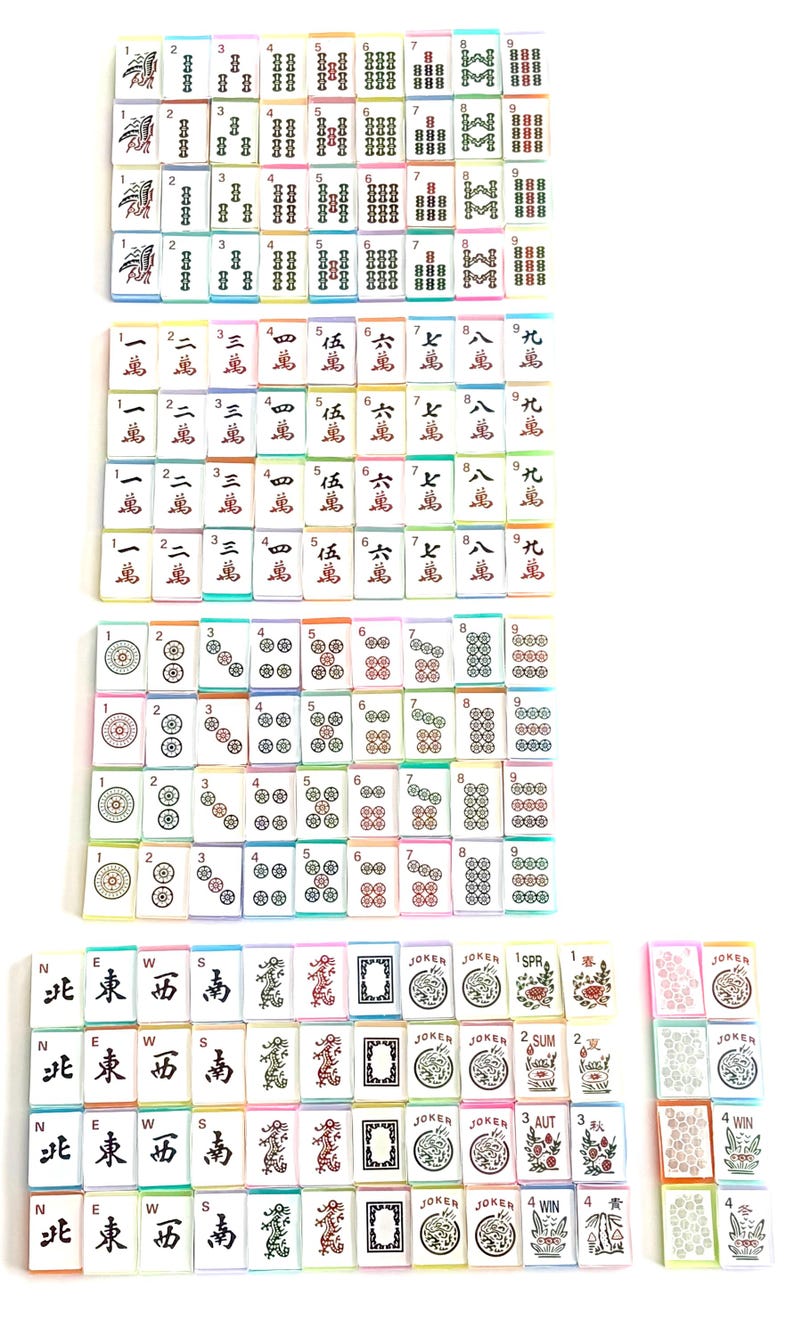 May include: A collection of colorful Mahjong tiles, featuring various symbols and numbers. The tiles are arranged in multiple stacks, showcasing the different suits and characters used in the game. The image includes tiles with the text "JOKER".
