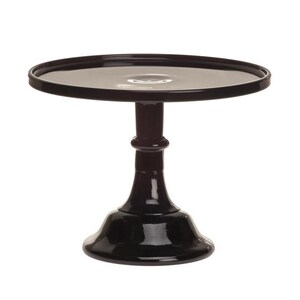 May include: A black cake stand with a round top and a pedestal base. The stand has a glossy finish and is designed to display cakes, cupcakes, or other desserts. The stand is made of a solid material and is suitable for various occasions.