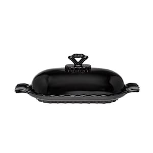 May include: A black ceramic butter dish with a lid. The dish has a rounded, oval shape with a decorative handle on top. The edges of the dish have a scalloped design. The butter dish is designed to hold a standard size of butter.