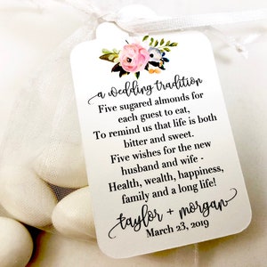 Puede incluir: Una tarjeta blanca con un dise&ntilde;o floral y el texto "a Wedding tradition" y un poema sobre cinco almendras azucaradas. La tarjeta tambi&eacute;n incluye los nombres "taylor + morgan" y la fecha "March 23, 2019".