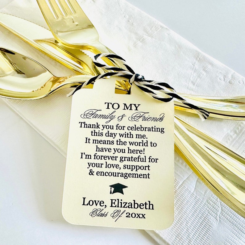 May include: A white card with black text that says "TO MY Family & Friends Thank you for celebrating this day with me. It means the world to have you here! I'm forever grateful for your love, support & encouragement Love, Elizabeth Class Of 20xx" with a black graduation cap icon.