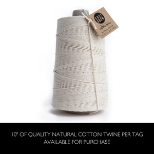 A spool of natural cotton twine shown.  Beneath a message that reads 10" of quality natural cotton twine per tag available for purchase.