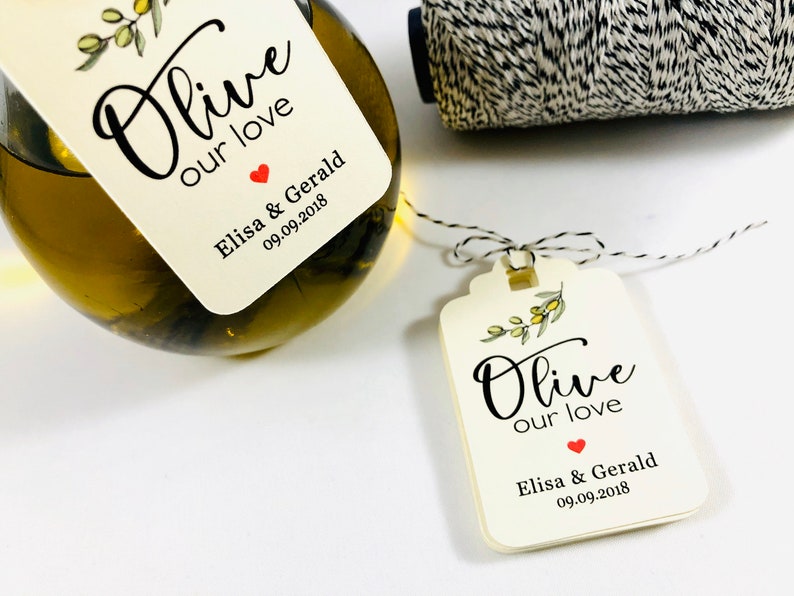 May include: Olive branch design wedding favor tag with the text "Olive our love" and the names "Elisa & Gerald" and the date "09.09.2018".