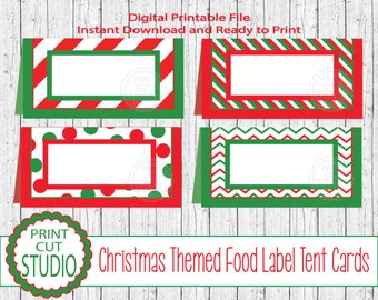 May include: Four printable Christmas themed food label tent cards. Each card has a different red and green pattern: stripes, polka dots, chevron, and a combination of stripes and polka dots. The cards are blank for writing in the name of the food.