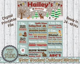 May include: A blue and brown printable chalkboard milestone chart for a first birthday. The chart features a winter woodland theme with a deer, a squirrel, and a bear. It includes milestones such as weight, height, favorite foods, and things the child can say and do. The chart is titled "Hailey's 1st Birthday" and "Winter Woodland Chalkboard Milestones".