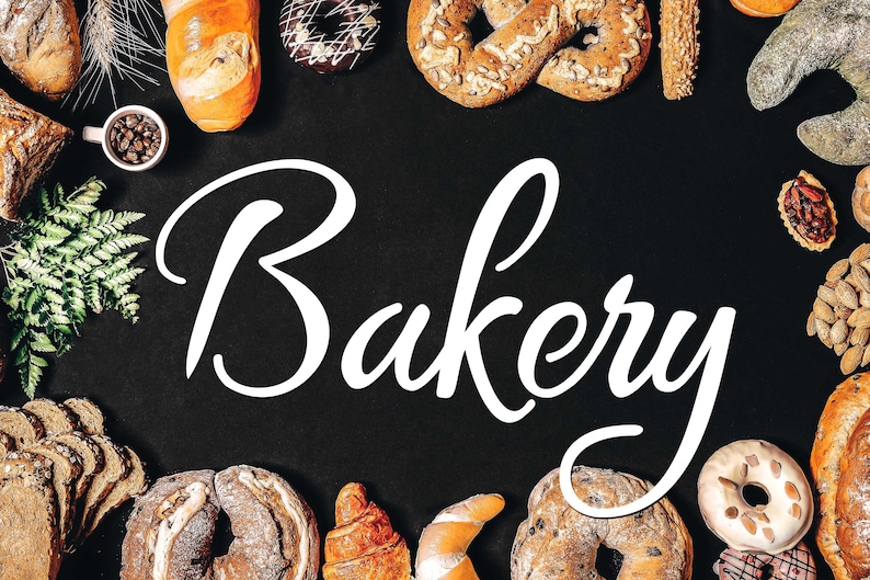 May include: An assortment of baked goods, such as bread, pastries, and doughnuts, surrounds the white script word "Bakery" on a black backdrop. The image displays a selection of freshly baked items.