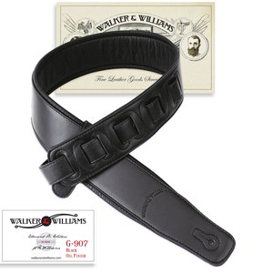 May include: Black leather guitar strap with a padded design and multiple stitched loops. The strap is labeled "Walker & Williams Fine Leather Goods Since" and "G-907 Black Oil Finish".