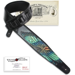 May include: Black leather guitar strap with a blue morpho butterfly design. The strap has a padded section for comfort and adjustable length. The strap is branded with "Walker & Williams" and "KB-57 Blue Morpho".