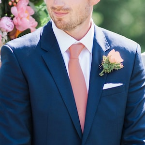 salmon tie blue suit