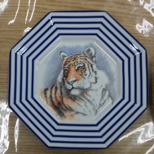 Two tiger plates to choose from octagonal is 7 3/4 across round one is approximately 9 inches across
