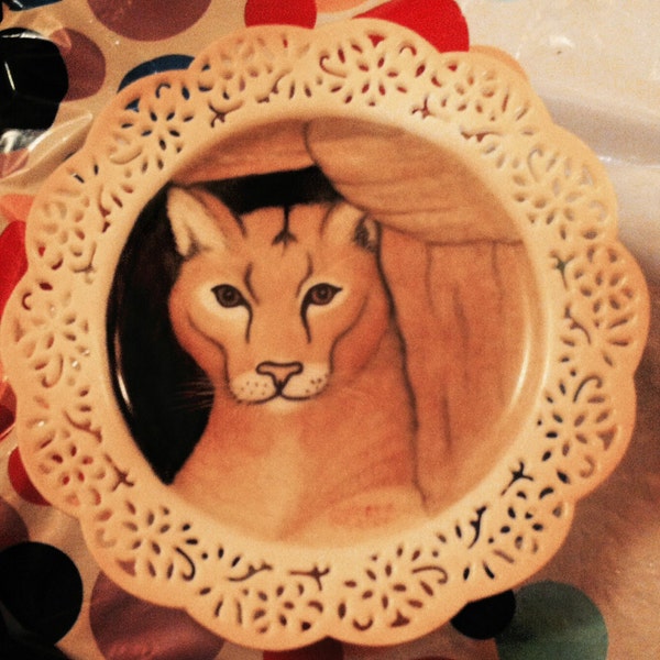 Young cougar inside a rock ledge porcelain plate hand painted oil