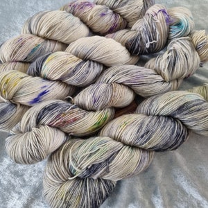 Cairn in the Thistles: Handdyed BFL/ Blue Faced Leicester superwash fingering weight sock yarn.
