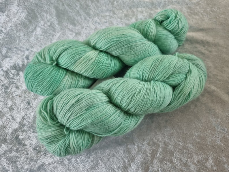 Sea breeze light spearmint tonal: Handdyed Merino single NON superwash light fingering weight yarn. image 1