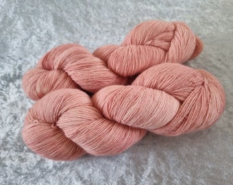 Peaches and Kreem (soft pink/peach) tonal: Handdyed Merino single NON superwash light fingering weight yarn.