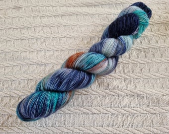 Wobbly Whale 2022: BFL ( Blue Faced Leicester) handdyed Superwash fingering weight high twist sock yarn.