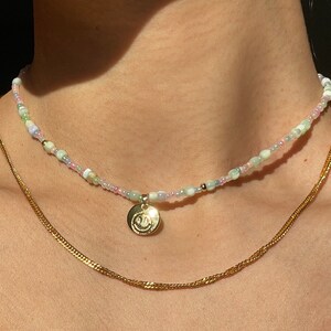 Beaded freshwater pearl necklace with mixed beads and smiley face charm