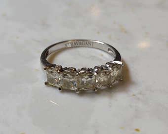 14k vintage solid white gold and CZ size 8 ring. Inside marked 14k SWJ, CZ and Korea. Beautiful, cheap, Xtravagant!