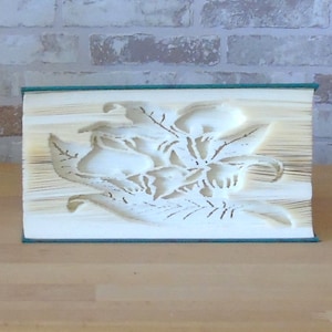 Lying lilies // folded book // book folding art // decoration // gift // book decoration // flowers in a book