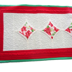White Quilted Christmas Table Runner with Poinsettia Cathedral Windows Edged in White with a Bold Red Border, 44&quot; x 16&quot;
