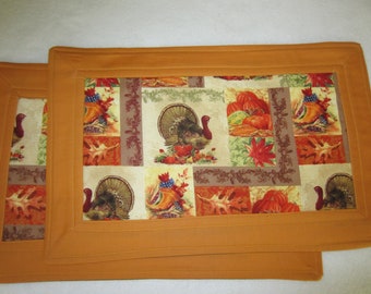 Pair of Orange and Brown Thanksgiving Themed Quilted Cotton Placemats With Turkeys and Autumn Leaves,  11" x 17 1/4"