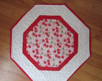 15.5" Tossed Tart Red Cherries on Soft Pink Background Octagonal Quilted Table Topper Rimmed in True Red with Custom Quilting