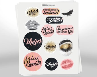 May include: A sheet of stickers with various designs, including lips, eyelashes, and text in French. The text includes "Merci", "Salut Beaute", "Magnifique", and "Attention contient du bonheur!"