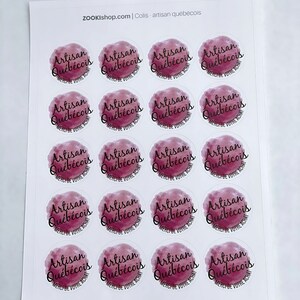 May include: Sheet of 16 round stickers with a watercolor design in shades of pink and purple. The stickers feature the text "Artisan Qu&eacute;b&eacute;cois" in black lettering with the words "Merci de votre achat" underneath.