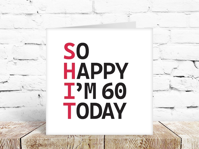 May include: A white card with black and red text that reads "SO HAPPY I'M 60 TODAY". The word "SO" is in red, and the rest of the text is in black.