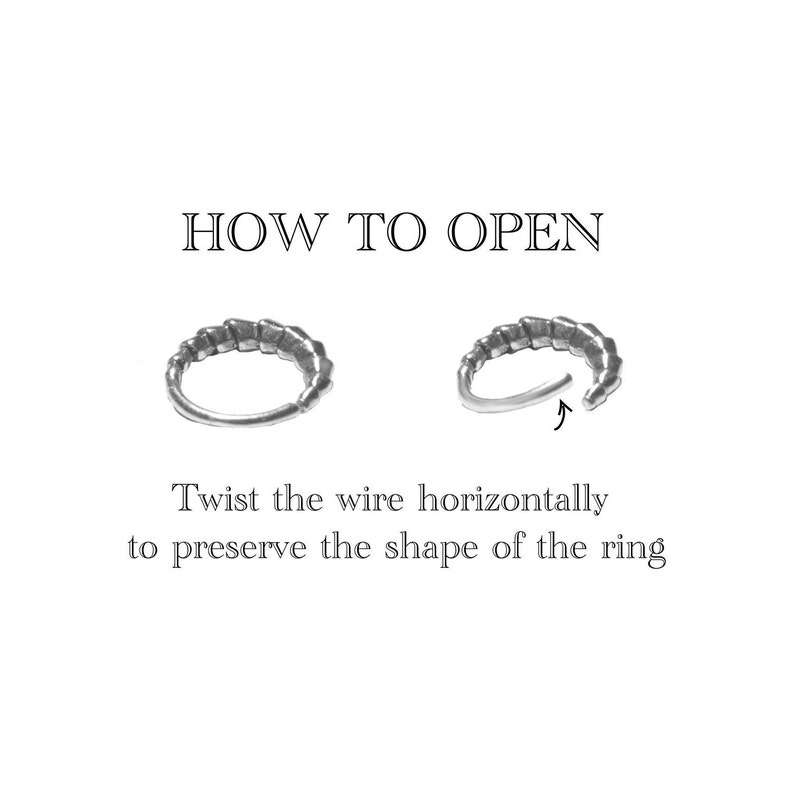 May include: Image showing instructions on how to open a ring. The text reads "HOW TO OPEN" above two silver rings. Below the rings, the text reads "Twist the wire horizontally to preserve the shape of the ring."