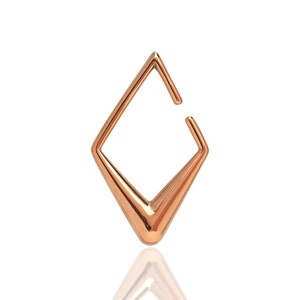 May include: A rose gold diamond-shaped hoop earring with a slightly open design.