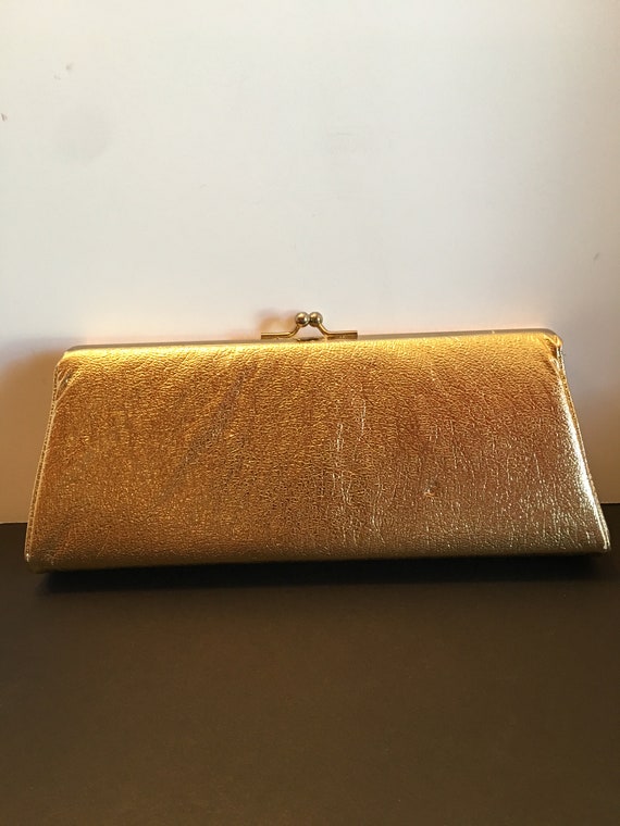 small gold clutch bag