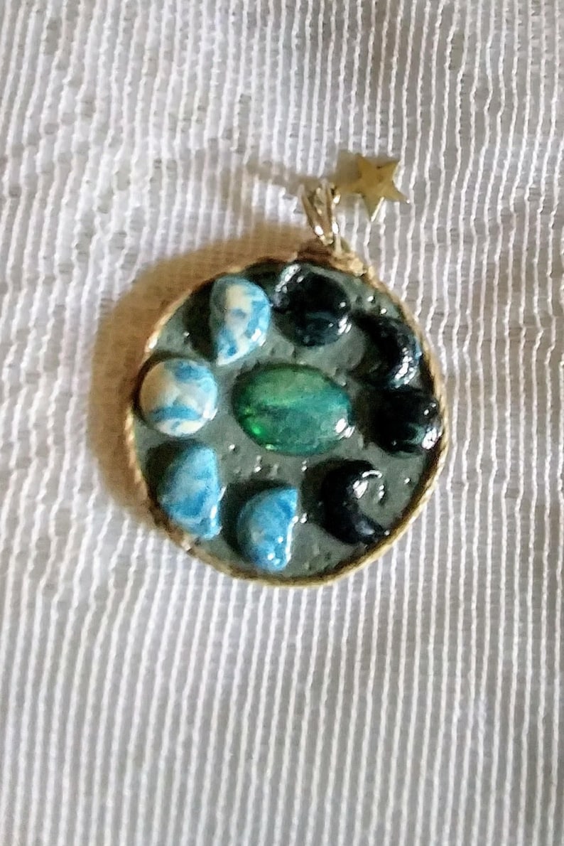 Many phases of Luna pendant