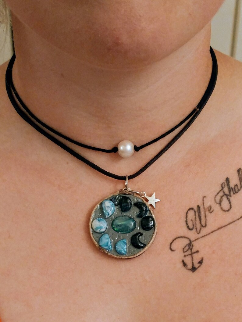 Many phases of Luna pendant