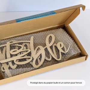 May include: A wooden sign that says "Welcome" in a cursive font. The sign is packaged in a brown cardboard box with bubble wrap for protection.