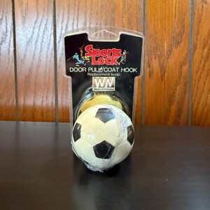 May include: A handmade wooden sign with the text "Welcome" in a playful font. The sign features a distressed white background and a dark stained wooden frame. Dimensions are approximately 12 inches wide and 6 inches tall.