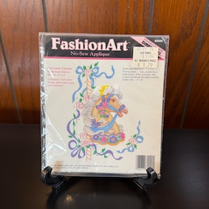 May include: A set of three ceramic mugs with a speckled, matte finish. The mugs are in shades of cream, light gray, and dark gray. Each mug has a simple, minimalist design and a rounded handle.