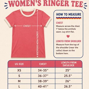 May include: A coral ringer t-shirt with cream-colored trim on the collar and sleeves. The image includes a sizing chart with measurements in inches, labeled with US sizes from XS to 2XL, and instructions on how to measure chest and length.