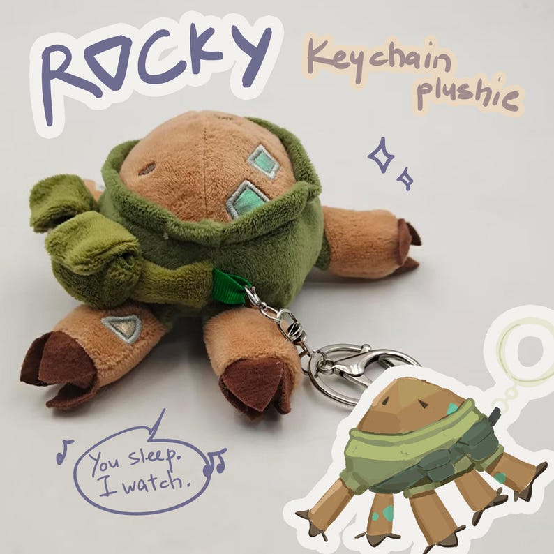 May include: A brown and green plush keychain featuring a creature with four limbs, dark brown hooves, and light blue square accents. The plush has a metal lobster clasp attached. Text on the image reads: ROCKY Keychain plushie and You sleep. I watch.