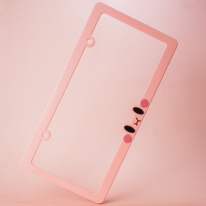 Kirby Eyes Plastic License Plate Frame: Kawaii Car Accessory