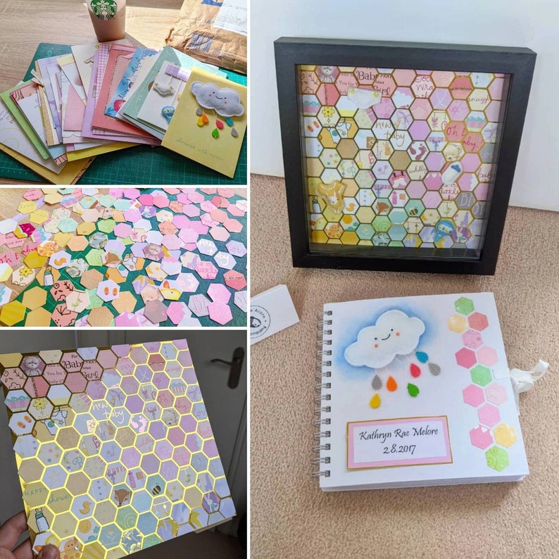 May include: A baby shower guest book with a honeycomb pattern and a cloud with raindrops. The book is white with a pink and yellow honeycomb pattern on the cover. The cloud is white with a smiling face and has rainbow coloured raindrops. The book has a pink label with the text "Kathryn Rae Melore 28.2017".
