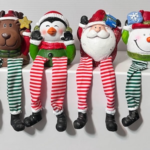 Christmas shelf sitters with dangling legs
