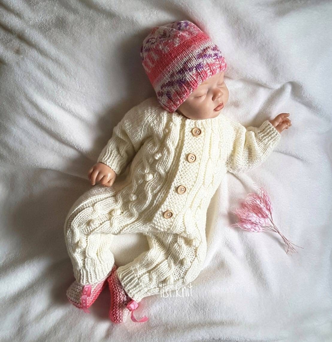 white knitted baby outfit
