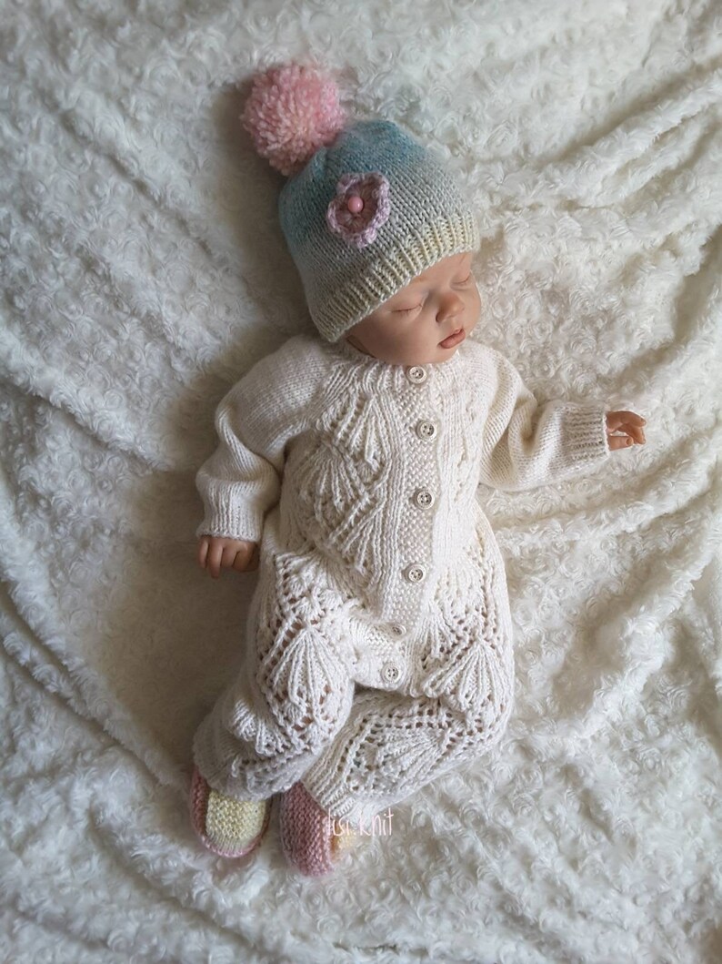 white knitted baby clothes