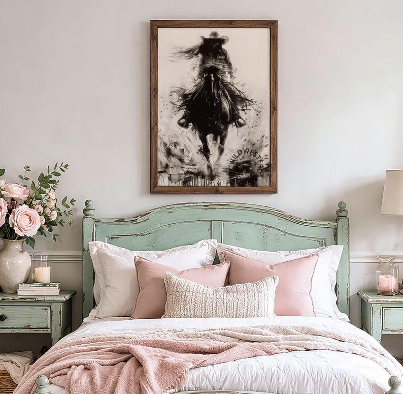May include: A framed wall art print featuring a black and white ink-style illustration of a person riding a horse at a gallop. The artwork displays a dynamic, splattered effect and includes the text WILDWESTRO in the lower right corner.